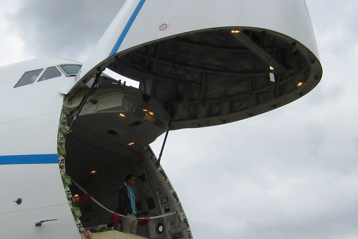 Boeing 747 freighter with the nose cargo door open for loading